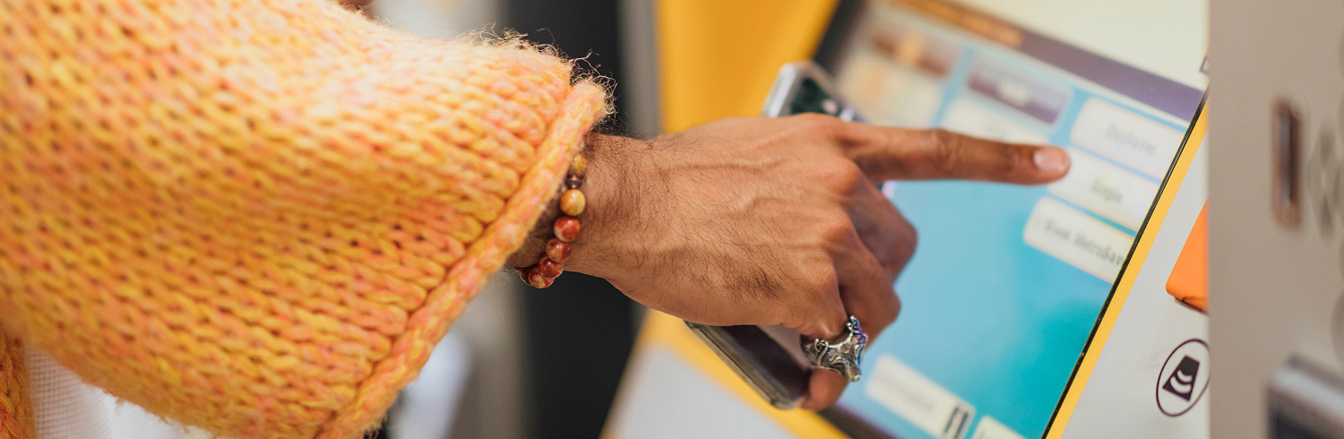Person buying a Metro ticket