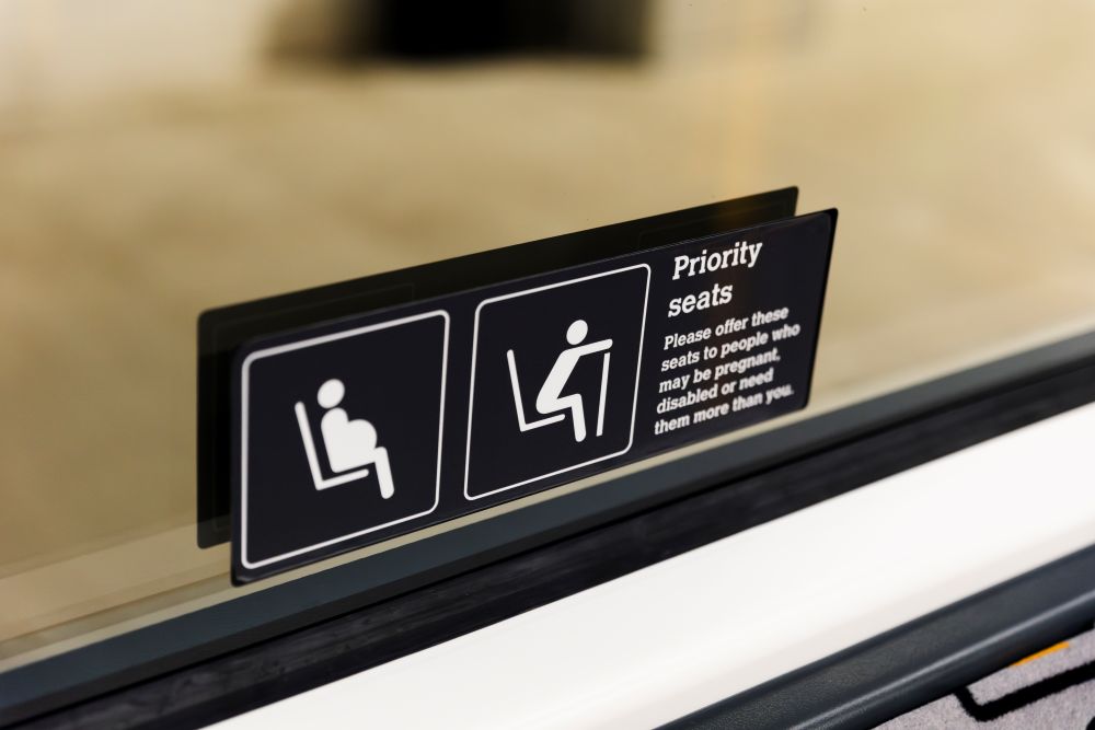 Signage on a Metro train showing priority seats