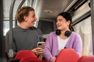 Young people chatting on a bus